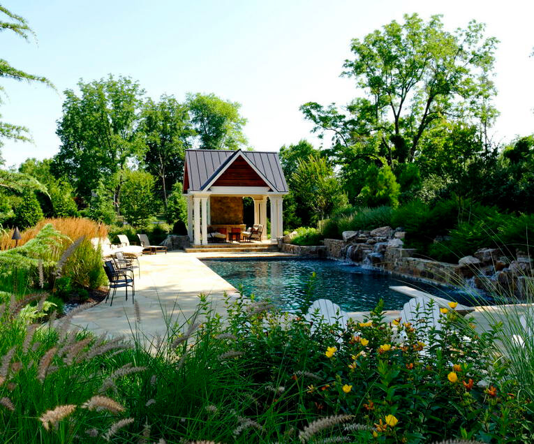 pool environment with water falls and pavilion