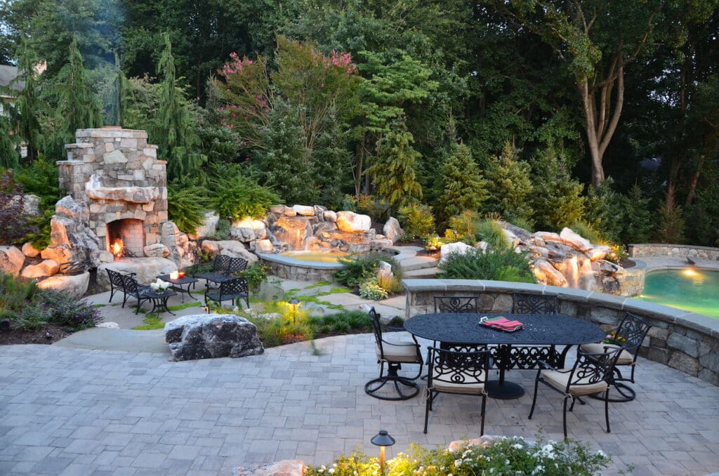 outdoor dining patio, fireplace, spa and waterfall design