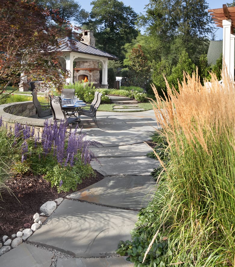 outdoor fireplace pavilion and irregular slab step path