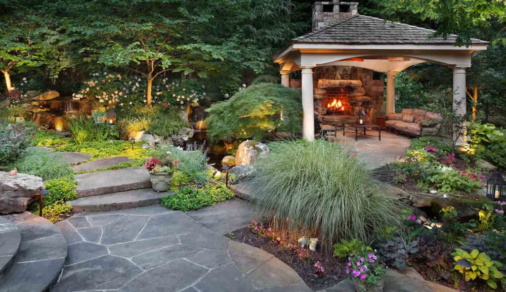 landscape maintenance around outdoor fireplace and pavilion
