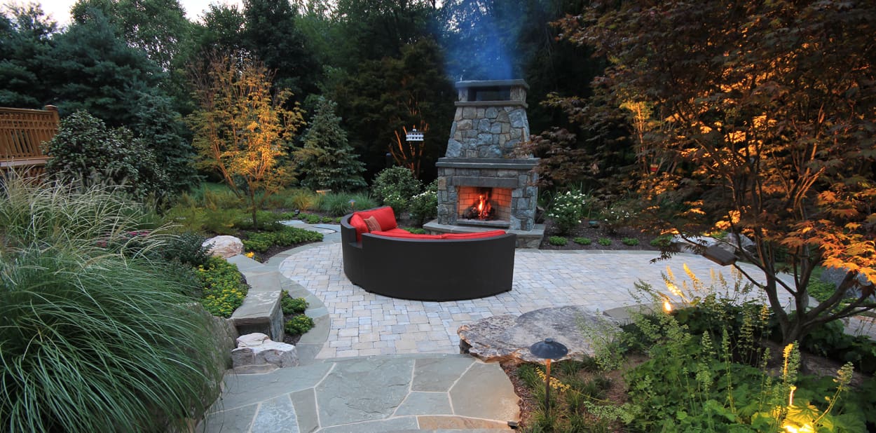 outdoor living room on open patio with fireplace