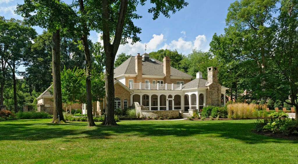 landscape design shows great lawn with porch and loggia in distance