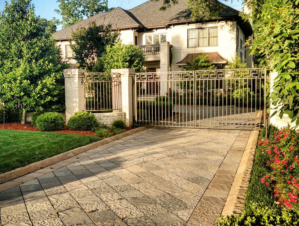 driveway design with textured pavers and curb stones