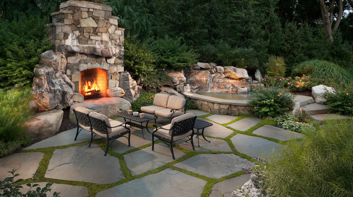 slab stone backyard patio with green joints
