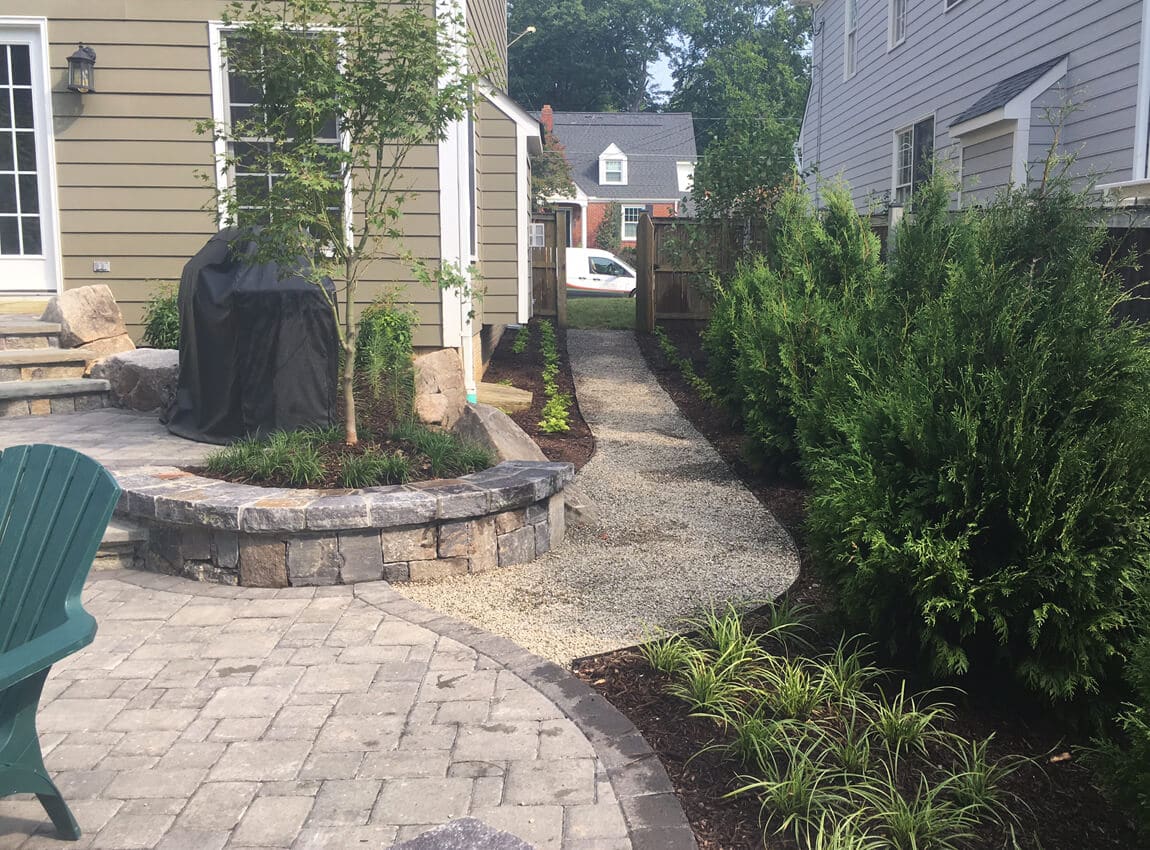 pea gravel path and plantings in side yard