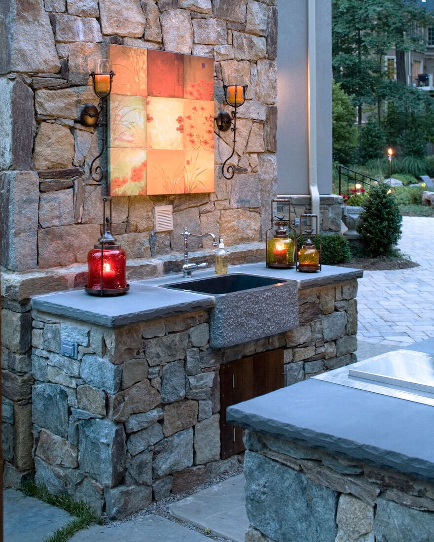 outdoor Kitchen accent lighting over farm style sink