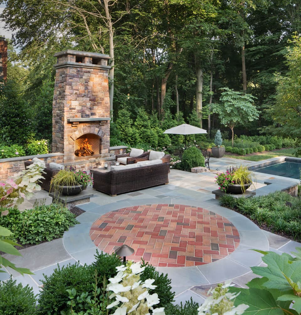 fireplace and sitting patio adjacent to spa