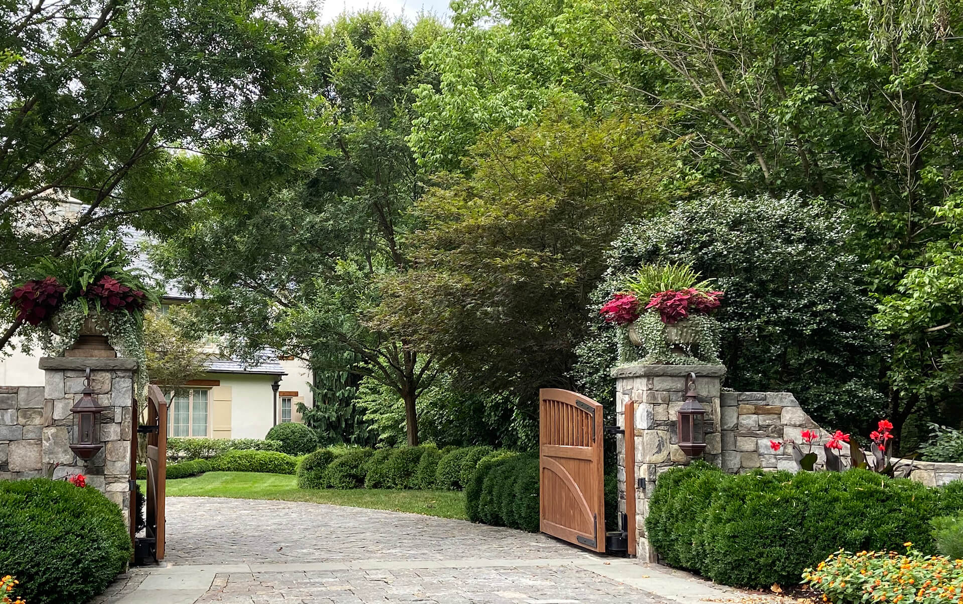 container plantings at driveway entry gate