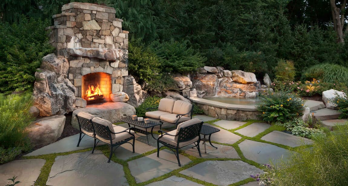 outdoor fireplace with fieldstone and building stone