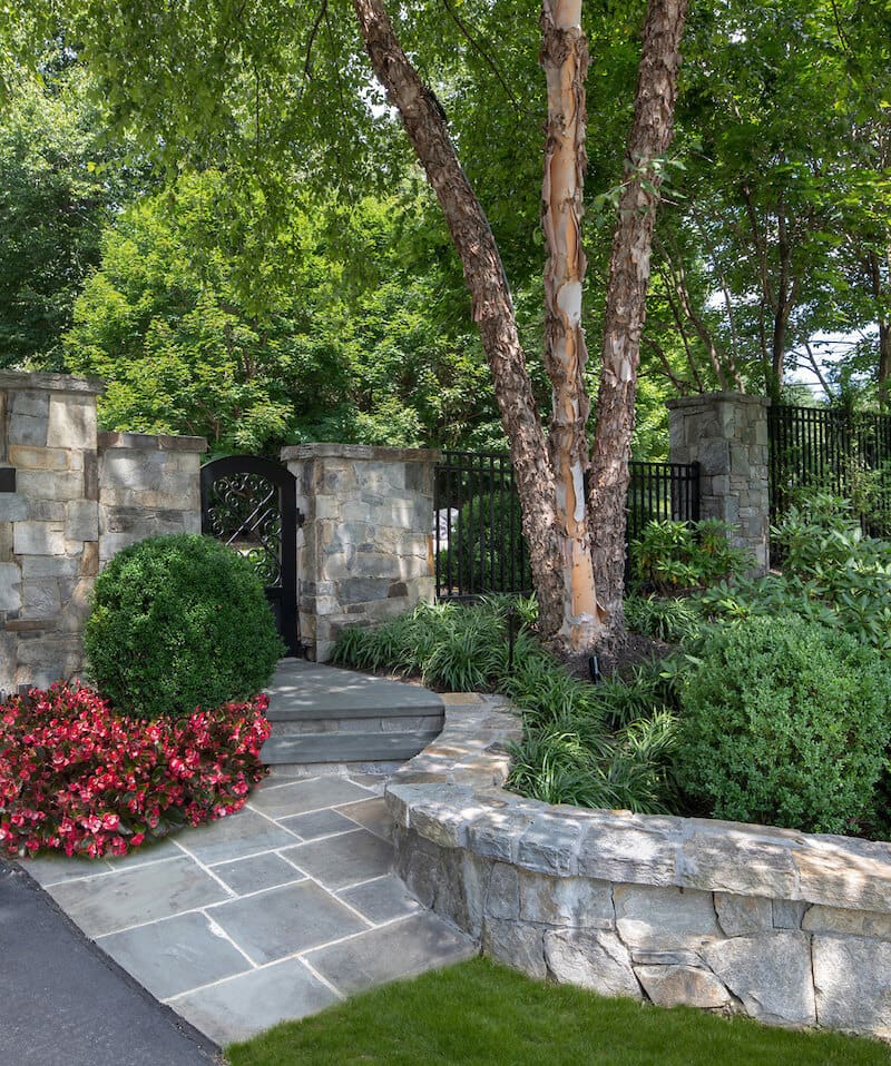 low retaining wall and bluestone walking path