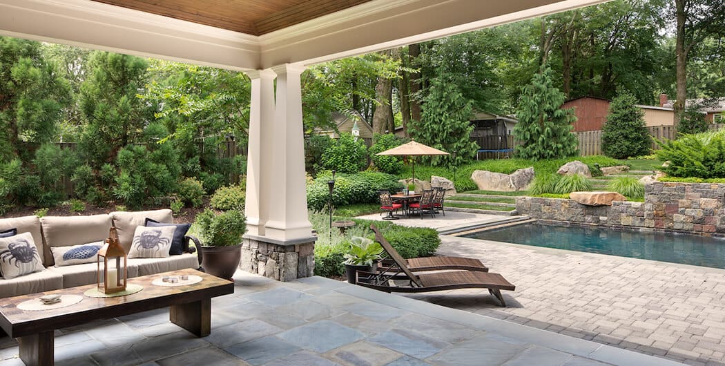 full shade structure and hedgerow provide poolside shade