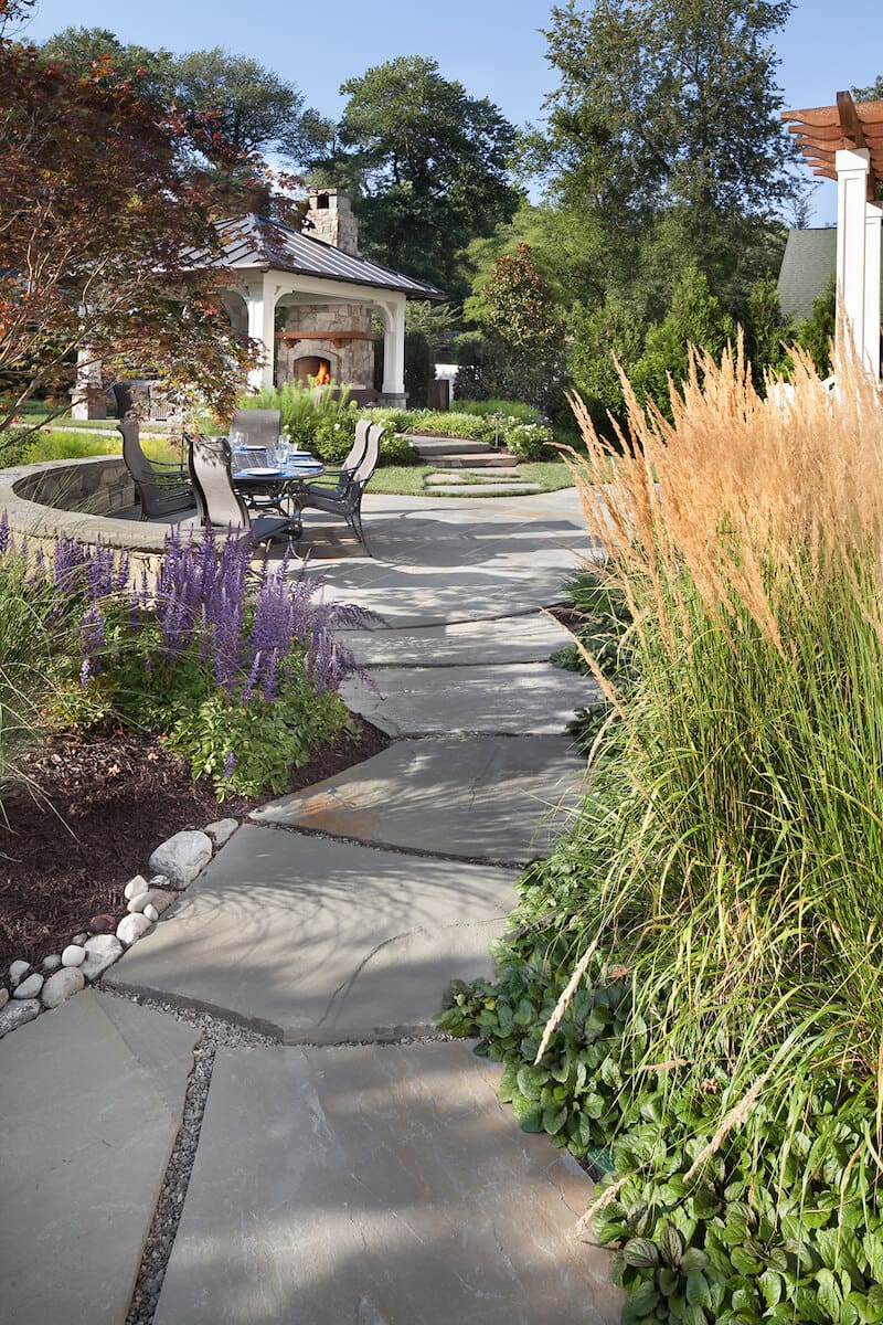 hardscaping designed to shed water directly into planting beds