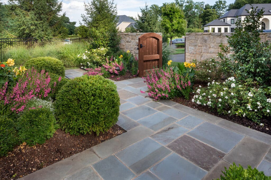 blooming perennials bordering walkway