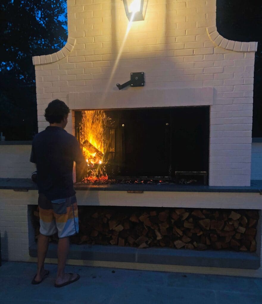 boy standing at parrilla grill