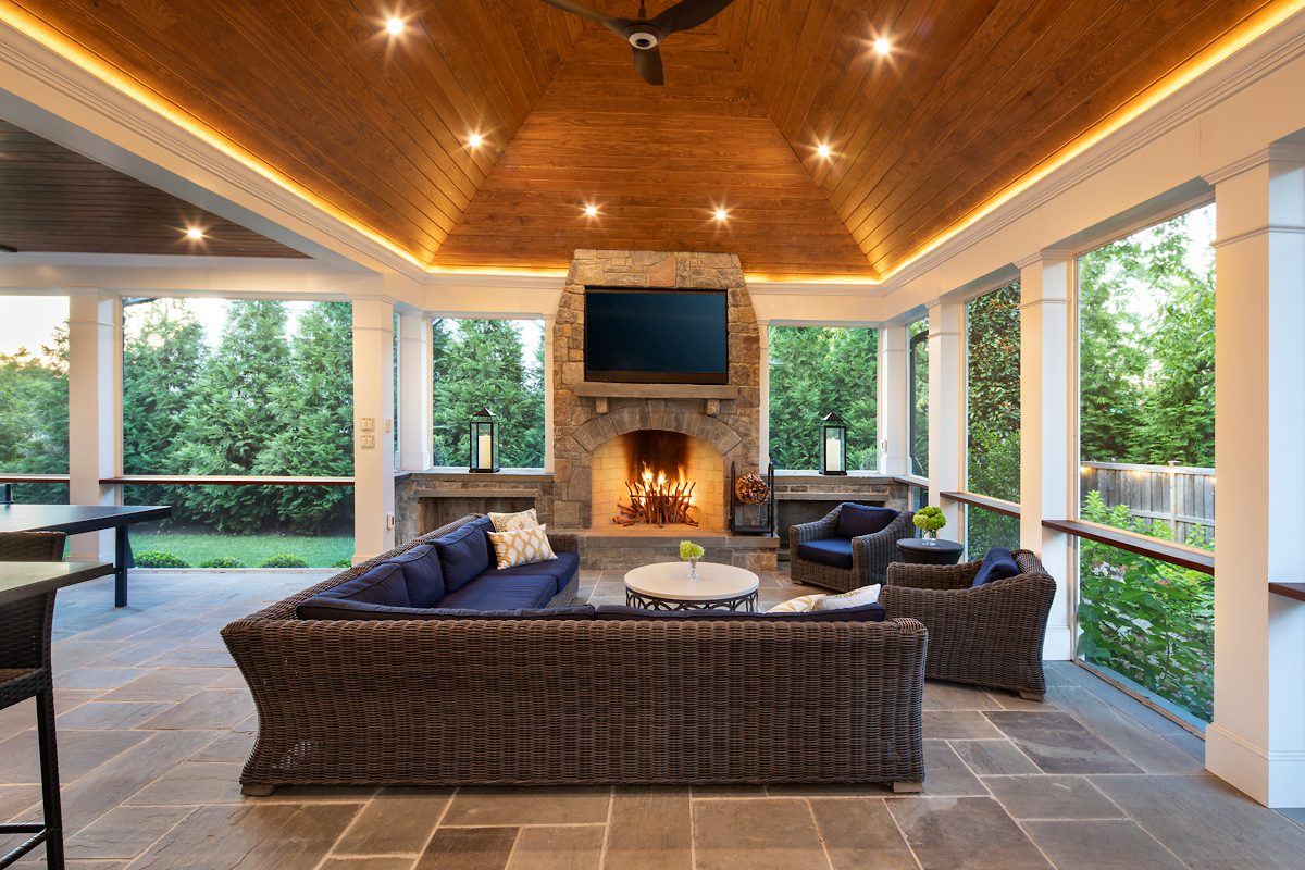 chevy chase screened porch with high ceilings and fireplace