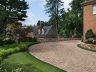 New curved driveway, privacy wall and iron works, plantings